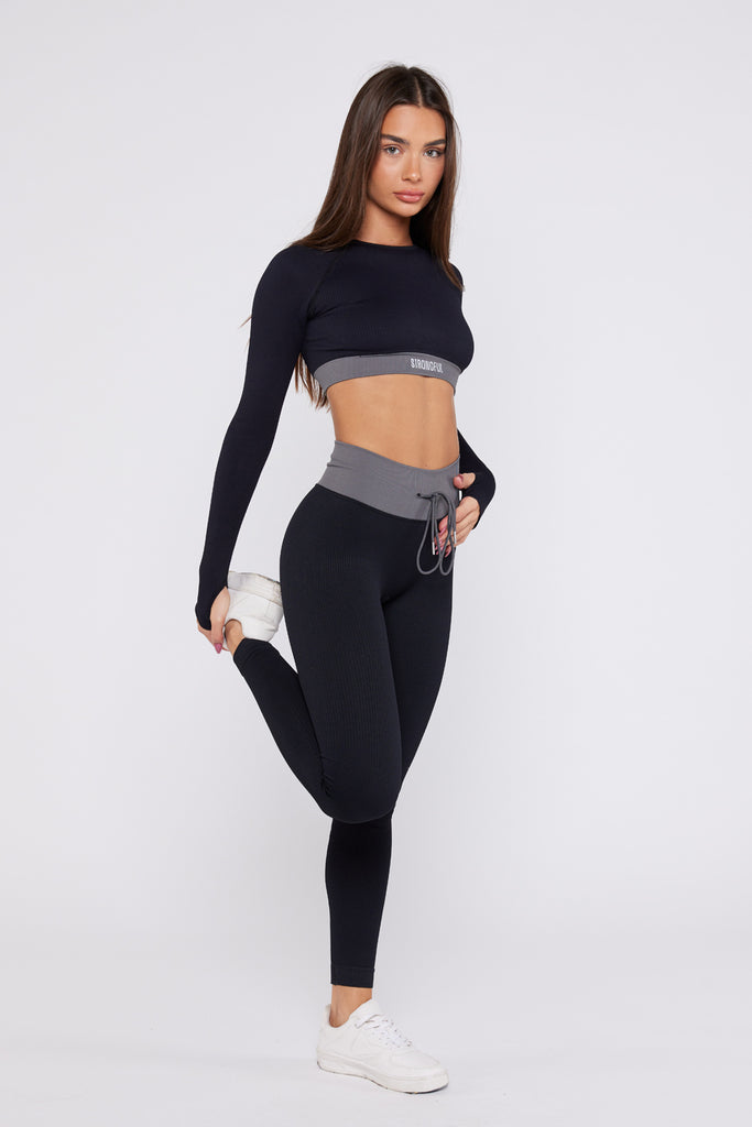 Bliss - חולצת קרופ טופ ספורטיבי בצבע שחור | XS